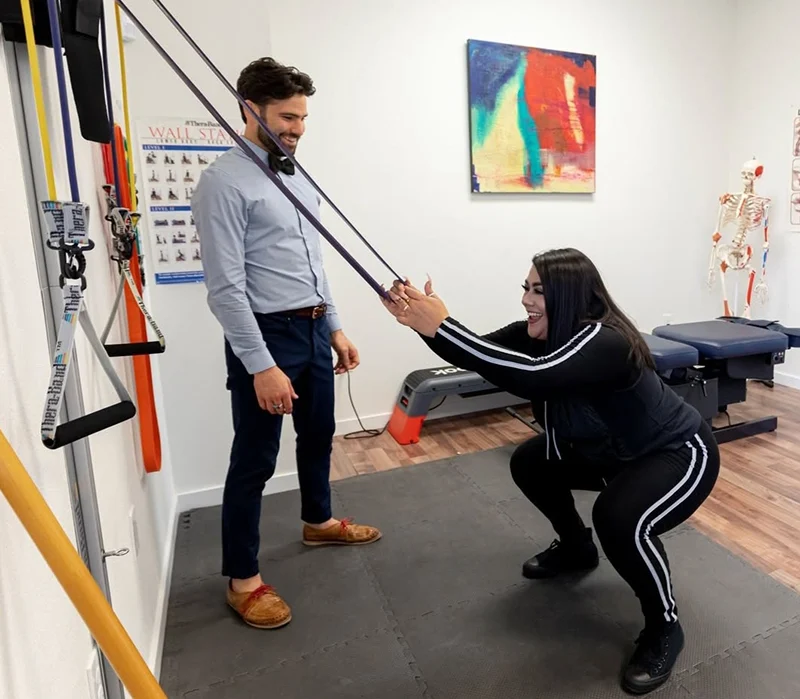 person working with chiropractor for work injury treatment