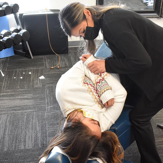 Chiropractor performing spinal adjustment